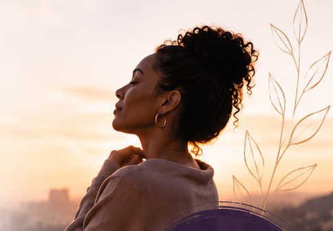 A woman looking toward the horizon at sunset